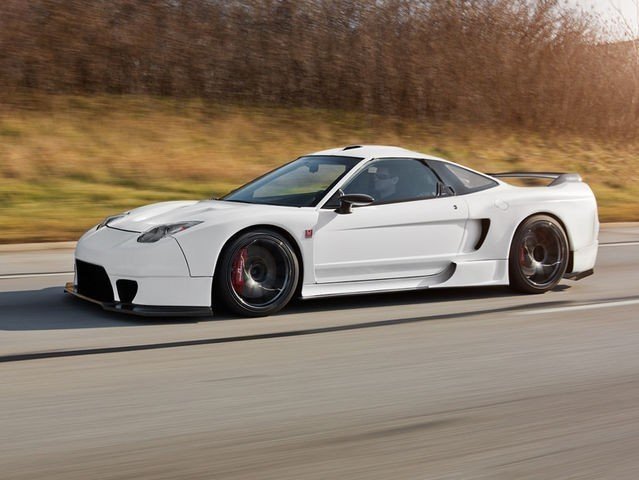 The Honda NSX was the first production car to...?