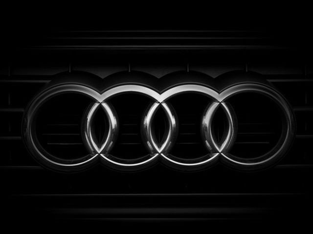 What do Audi's four rings represent?