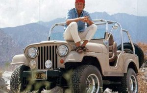 Steve McQueen with his Jeep CJ5 special V8 taking a break from training for the Baja 1000 offroad race, 1969.