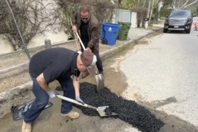 Fed up by L.A. pothole, Arnold Schwarzenegger fills it himself