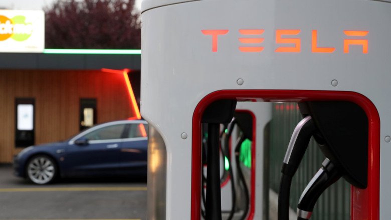 Tesla stock jumps on EV charging tie-up with GM