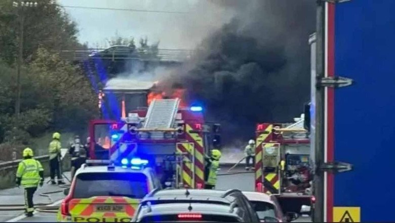 Half-term getaways are plunged into chaos as M5 closes: Drivers stuck in five hour queue resort to playing football to pass the time after huge lorry blaze