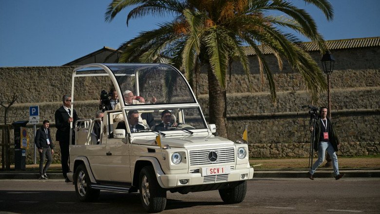 The Pontiff goes electric! Pope Francis makes first appearance in battery-powered 'G-Wagon popemobile' during trip to Corsica