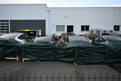Tesla showroom is torched in arson attack in France with £550,000 of cars destroyed amid growing fury in Europe over Elon Musk's EU 'meddling' and Trump Ukraine funding row