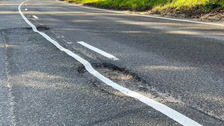 Hole lot of trouble! Council contractor paints white lines over large potholes BEFORE they were filled in