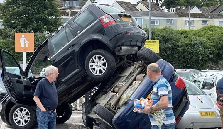 You can't park there! Land Rover ends up on top of another vehicle after Sainsbury's supermarket car park crash