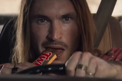 TV Twix advert is BANNED for encouraging dangerous driving - because it shows long-haired driver crashing his caramel-coloured motor on top of another car