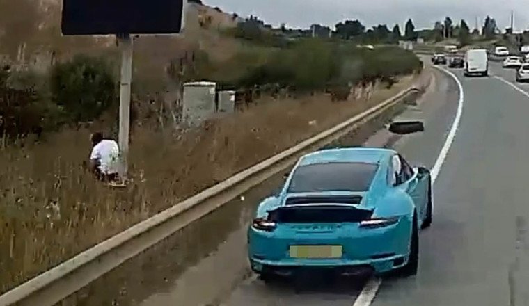 Wannabe fraudster, 33, who tried to claim £74,000 after lorry smashed into his Porsche is caught out... because dashcam snapped him 'hiding in bushes'