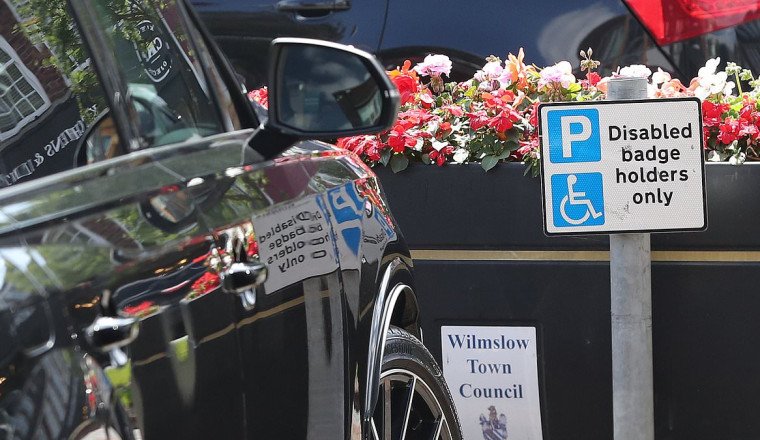 Wayne Rooney almost falls foul of Cheshire traffic wardens after leaving his Audi 4x4 in a disabled parking zone - as ex footballer 'prepares for £400,000 a year Match Of The Day role'