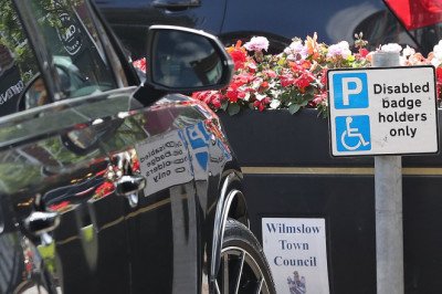 Wayne Rooney almost falls foul of Cheshire traffic wardens after leaving his Audi 4x4 in a disabled parking zone - as ex footballer 'prepares for £400,000 a year Match Of The Day role'